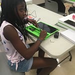 OWL Scholar assembling her computer. 