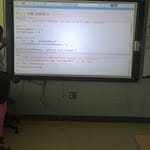 Scholar explaining conditional her understanding of conditional loops to the class