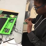 Kid installing prototyping board
