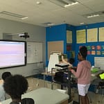 Kid demonstrates her website on Climate Action 