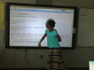 Kid explaining sort algorithm to class.