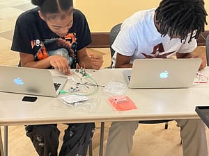 Session 5 Highlights STEM Leadership Corps Fall 2024, kids working on Raspberry Pi Picos.