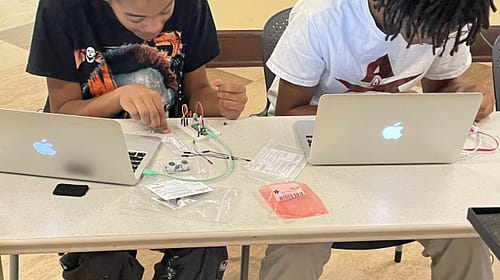 Session 5 Highlights STEM Leadership Corps Fall 2024, kids working on Raspberry Pi Picos.
