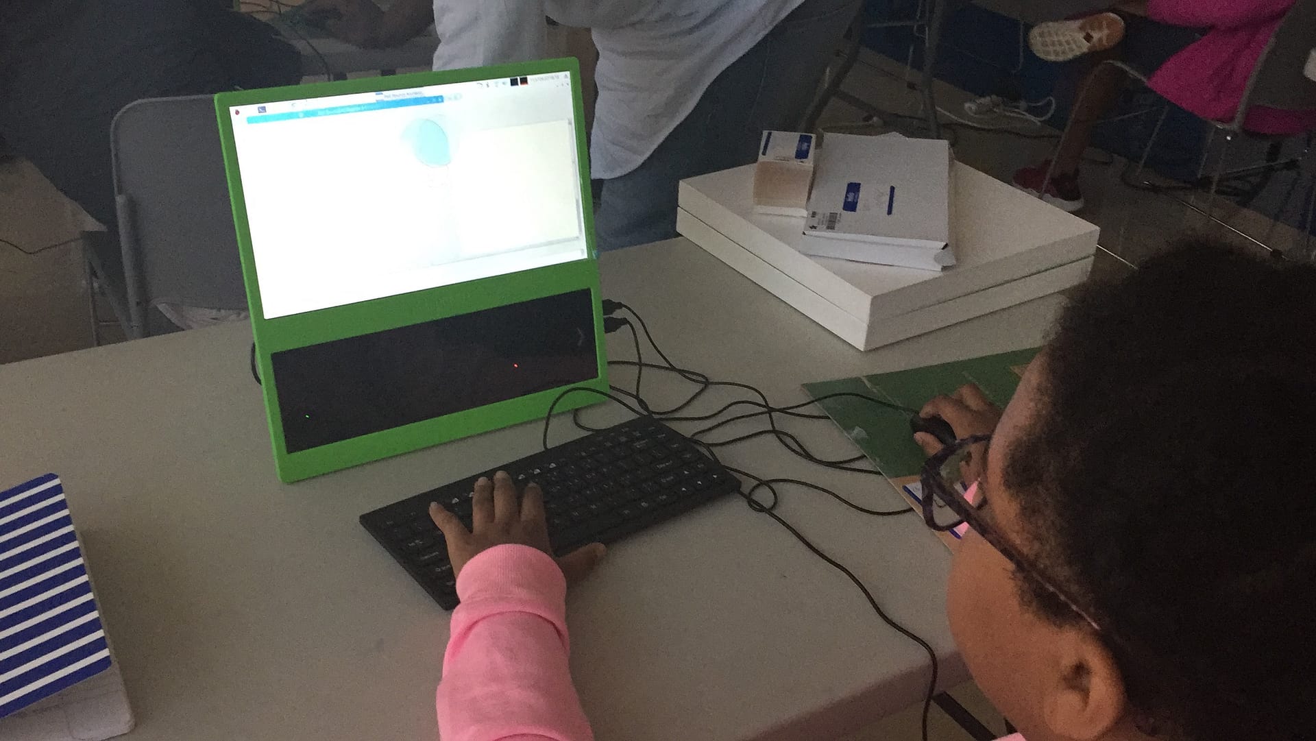 Kid coding animation of bouncing balls. 