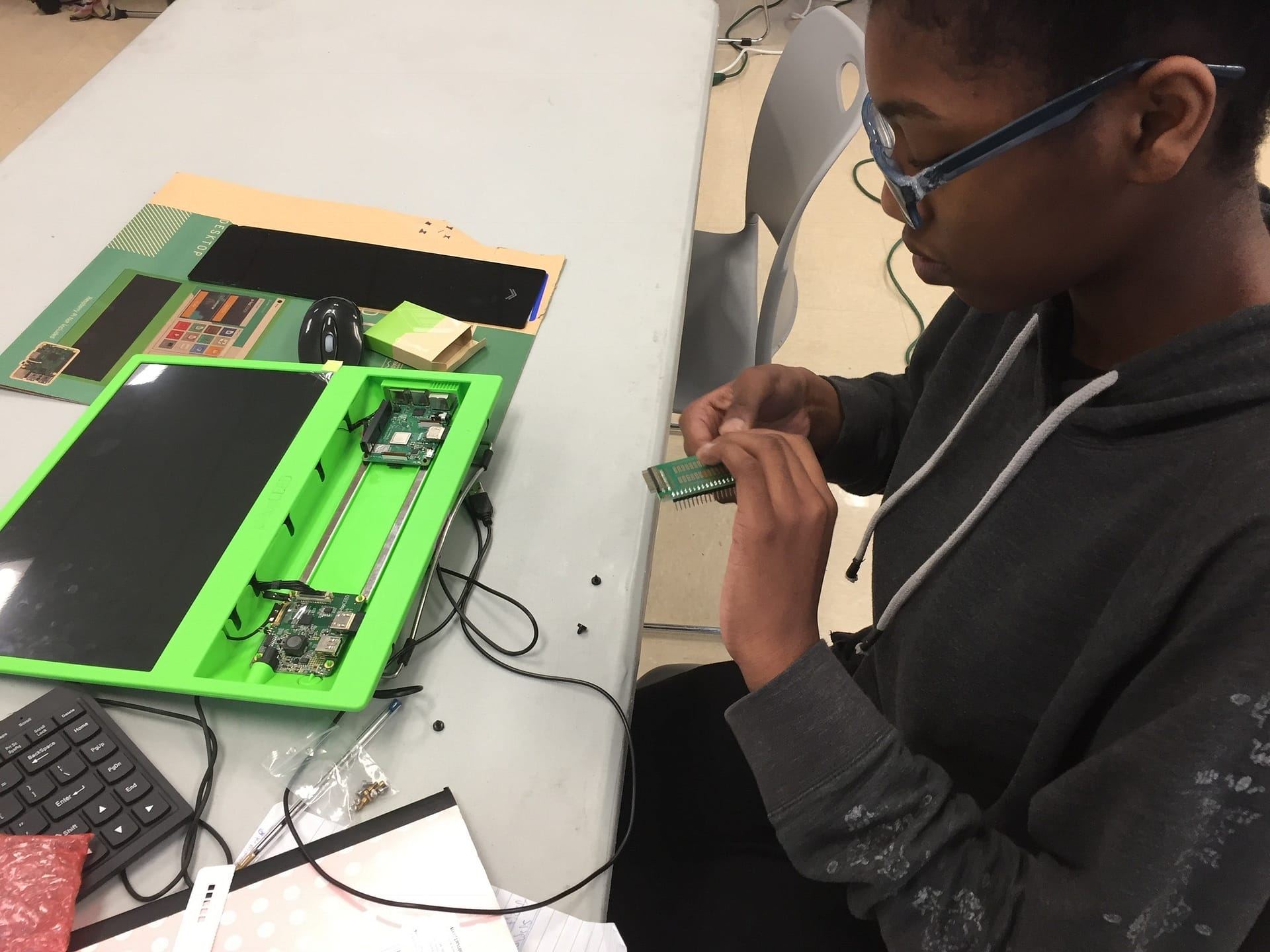 Kid installing prototyping board